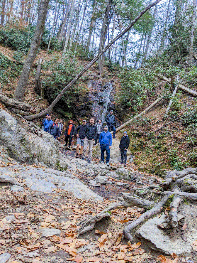 Casa team members on a hike through the woods